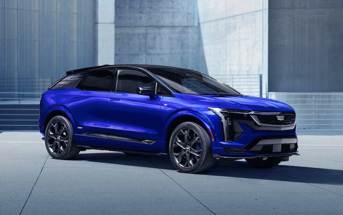Blue 2026 Cadillac Optiq-V viewed from the front three-quarter angle