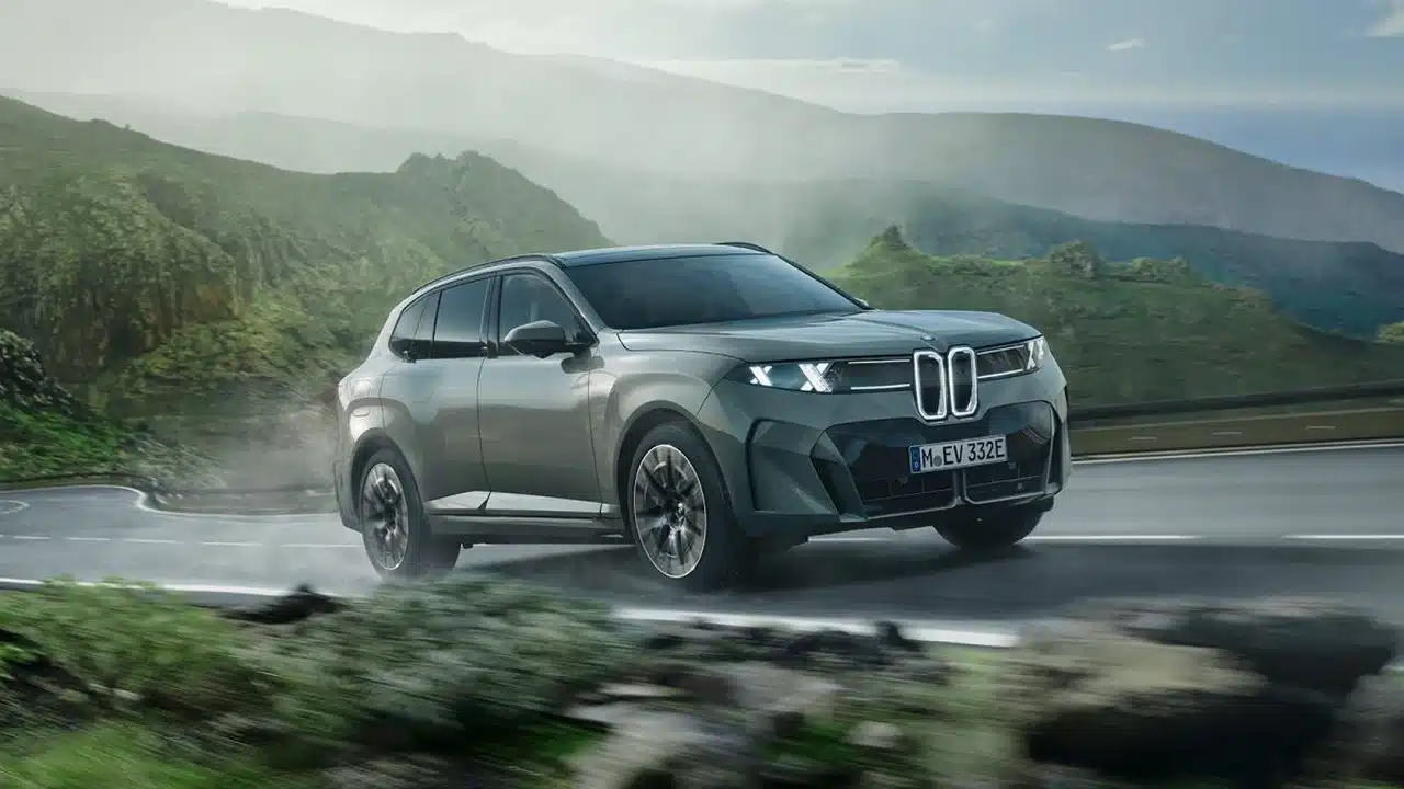 New BMW X5 family SUV driving on a mountain road