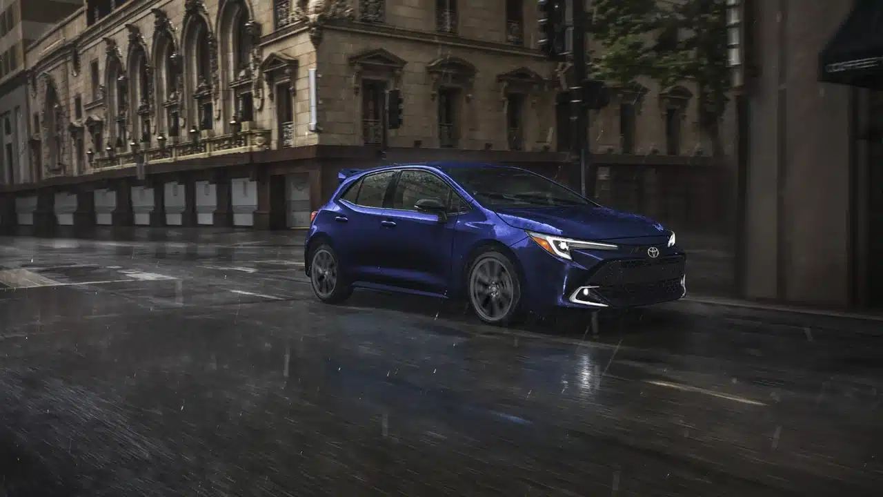Blue 2027 Toyota Corolla Hatchback parked on a city street