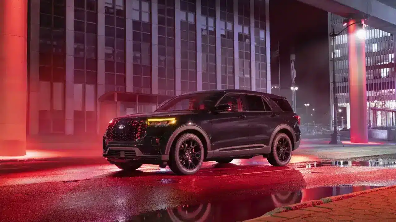 2027 Ford Explorer ST Sinister parked on a city street at night