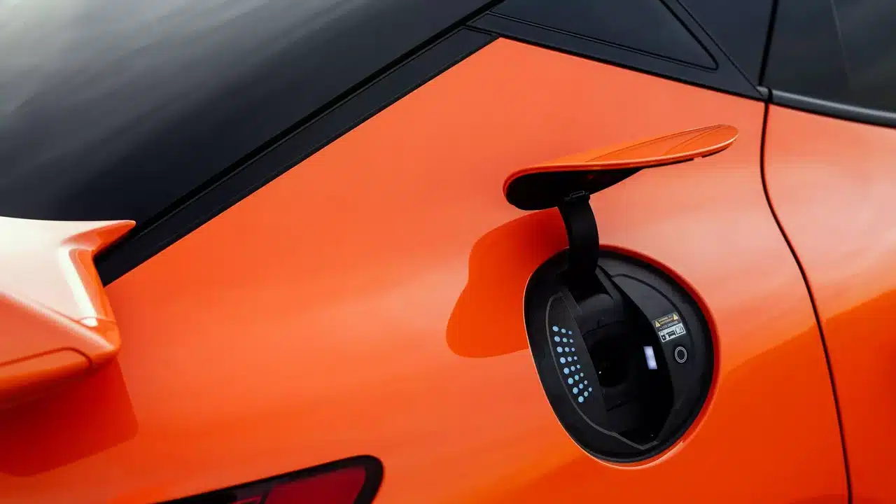 Charging port on an orange Genesis GV60 Magma
