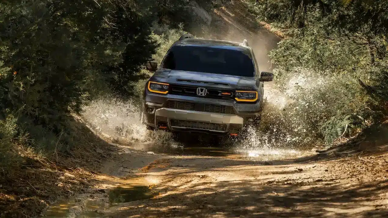 2027 Honda Passport TrailSport driving through shallow water