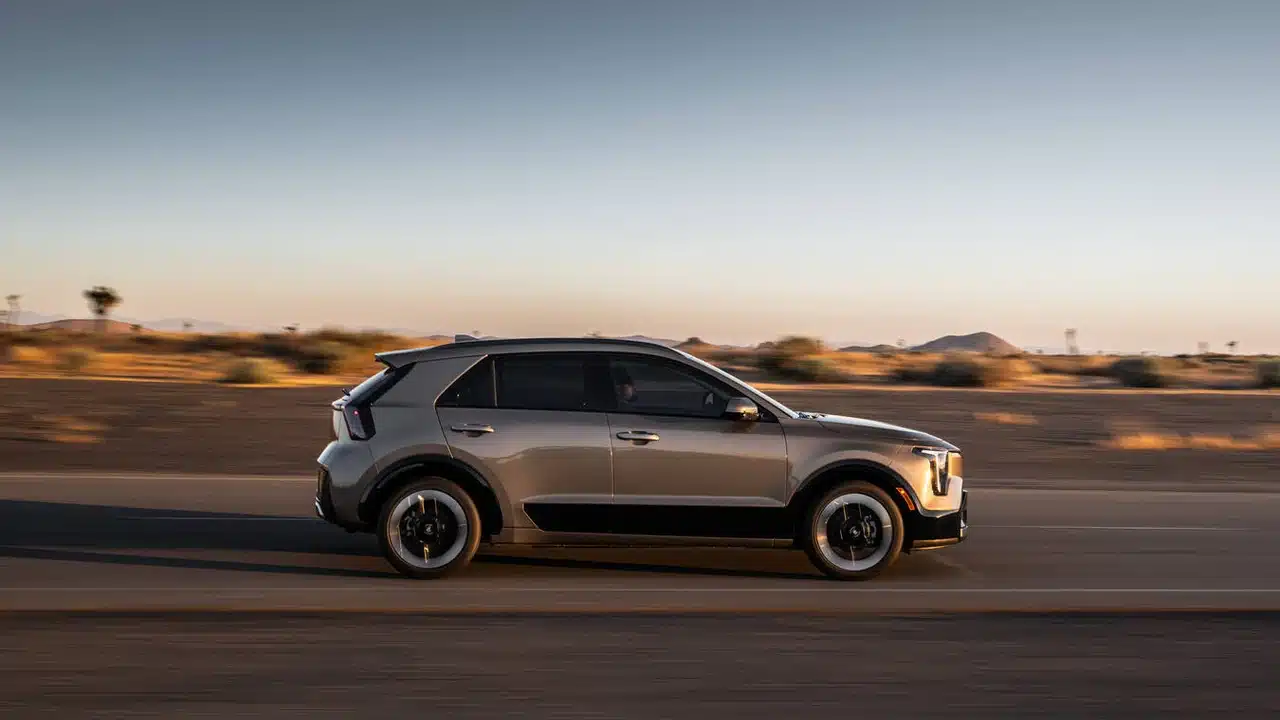 2027 Kia Niro hybrid driving in side profile