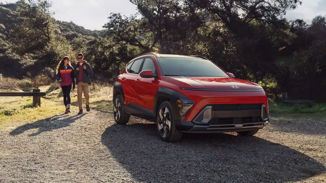 Hyundai Kona Limited parked beside a wooded trail