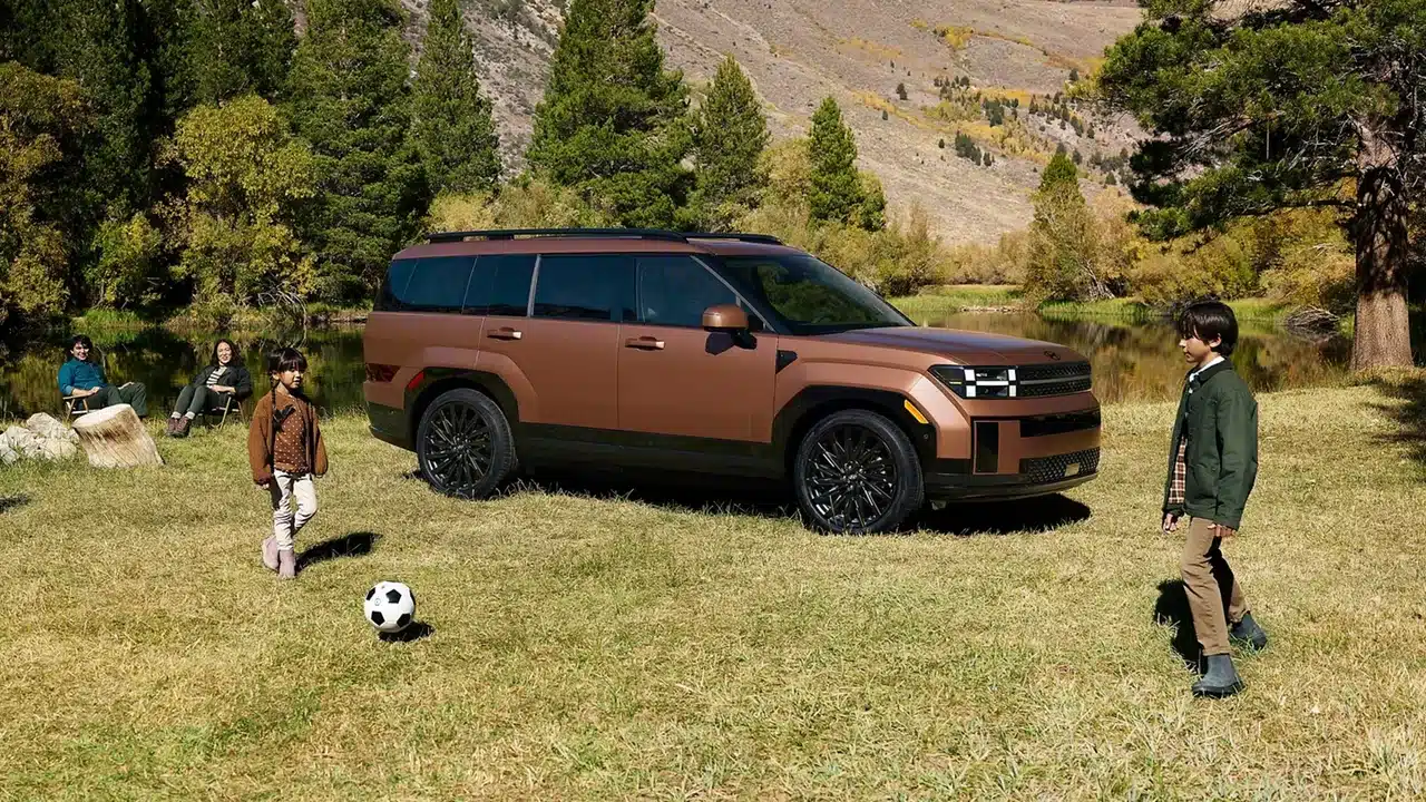 2027 Hyundai Santa Fe Calligraphy parked near a mountain meadow