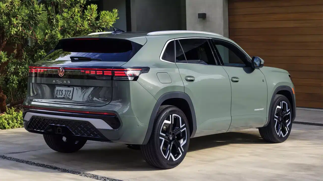 2027 Volkswagen Atlas Cross Sport rear three-quarter view in Dark Sage Metallic