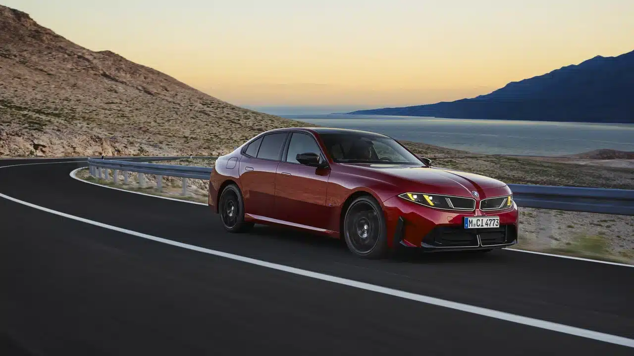 Red 2027 BMW M350 xDrive on a winding road