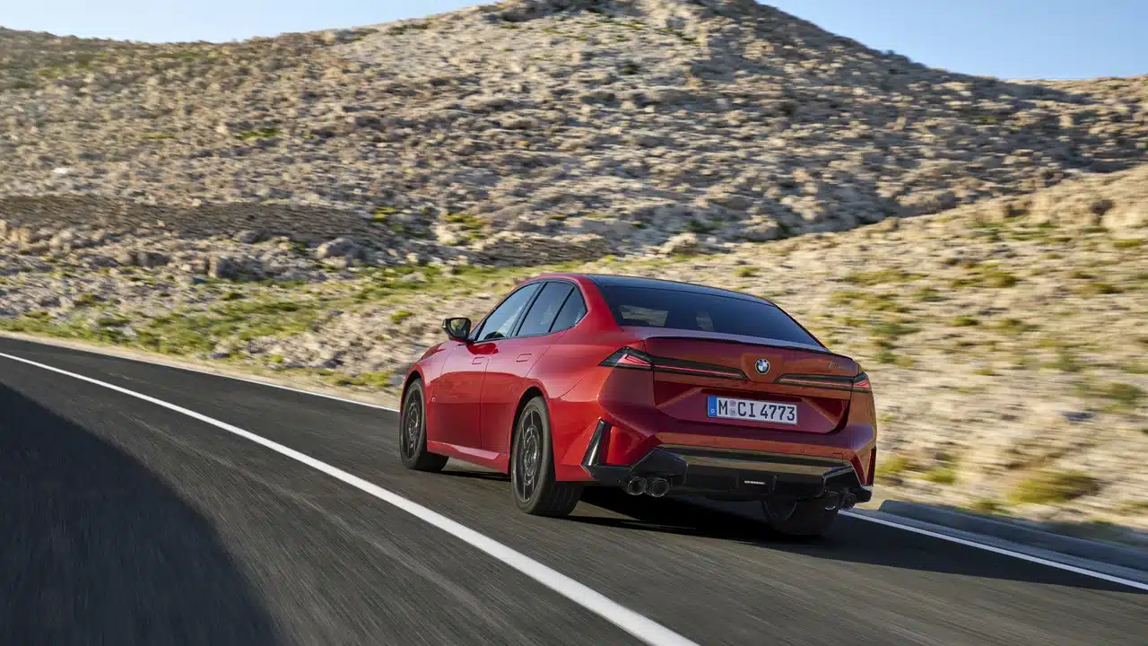 Rear view of the red BMW M350 xDrive with four exhaust outlets