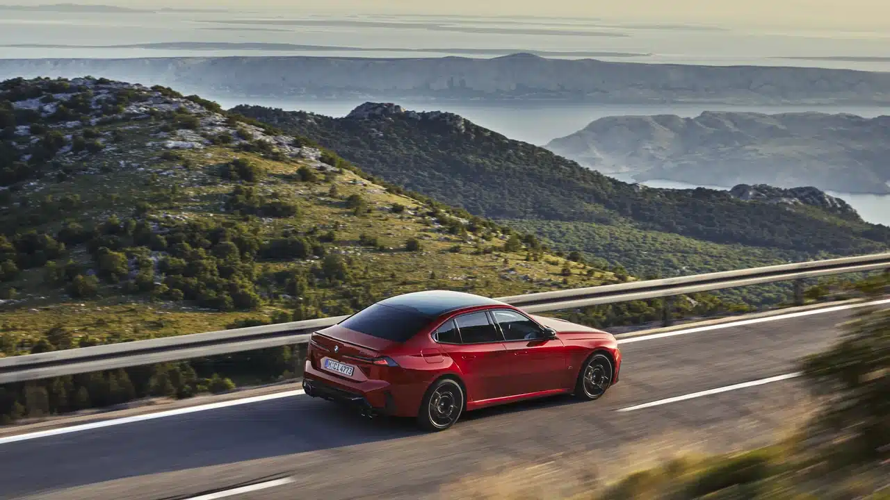 BMW M350 xDrive traveling through mountain scenery