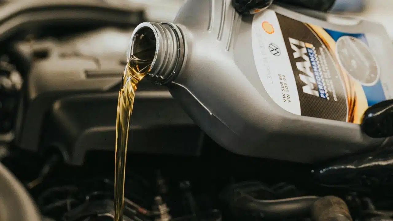 Motor oil being poured into an engine