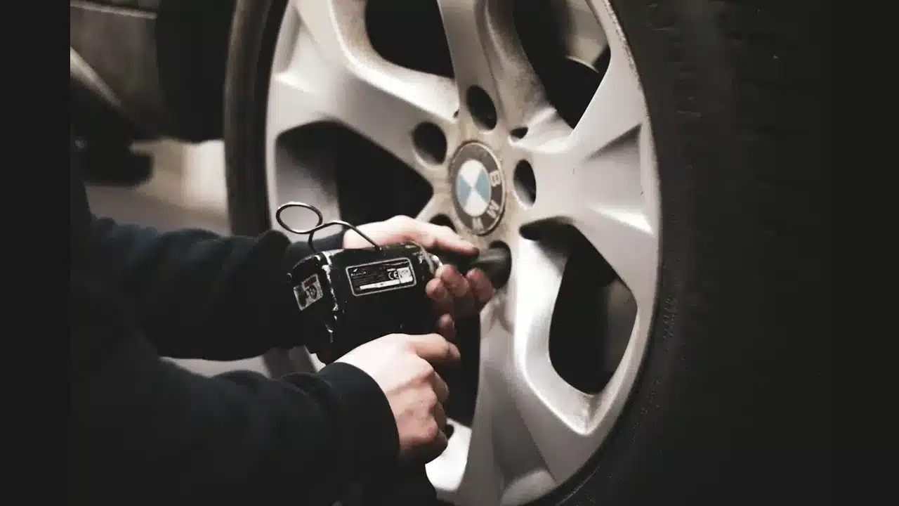 Mechanic working on a vehicle during a service inspection