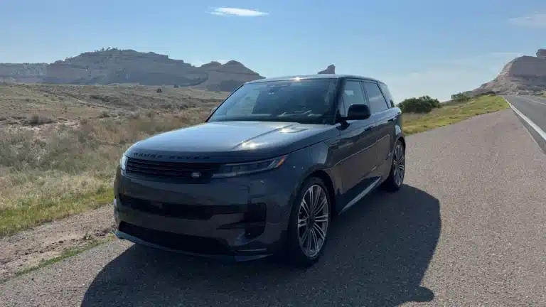 Blue Range Rover Sport parked beside a Nebraska road