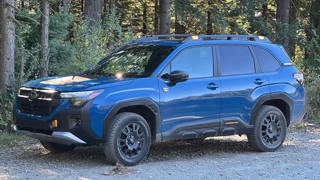 Blue Subaru Forester Wilderness parked beside a trail