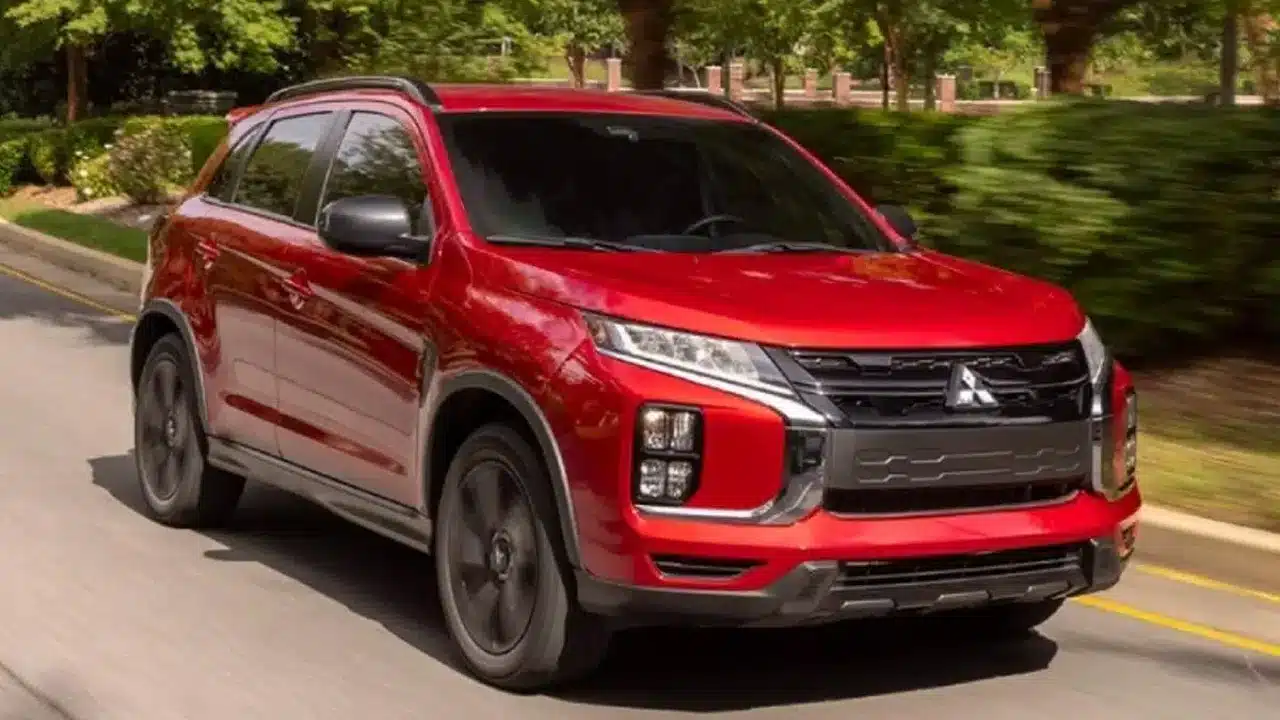 Red Mitsubishi Outlander Sport on a road