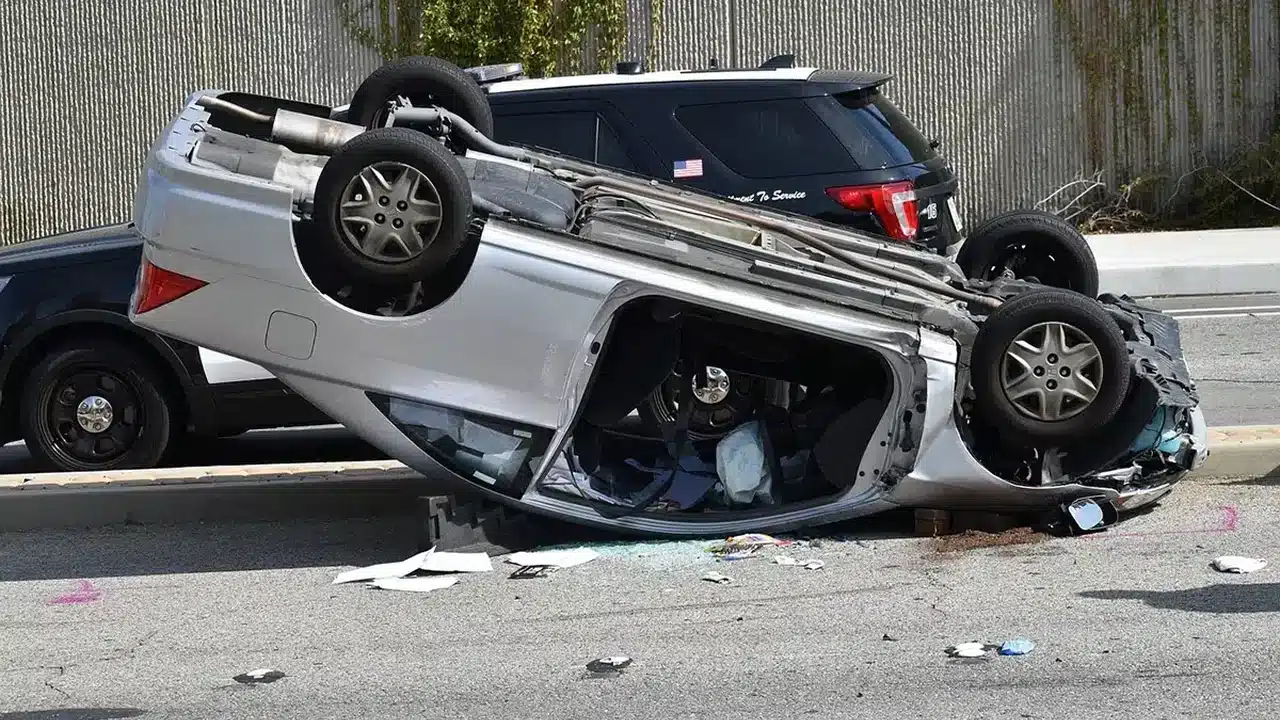 Overturned vehicle at a collision scene