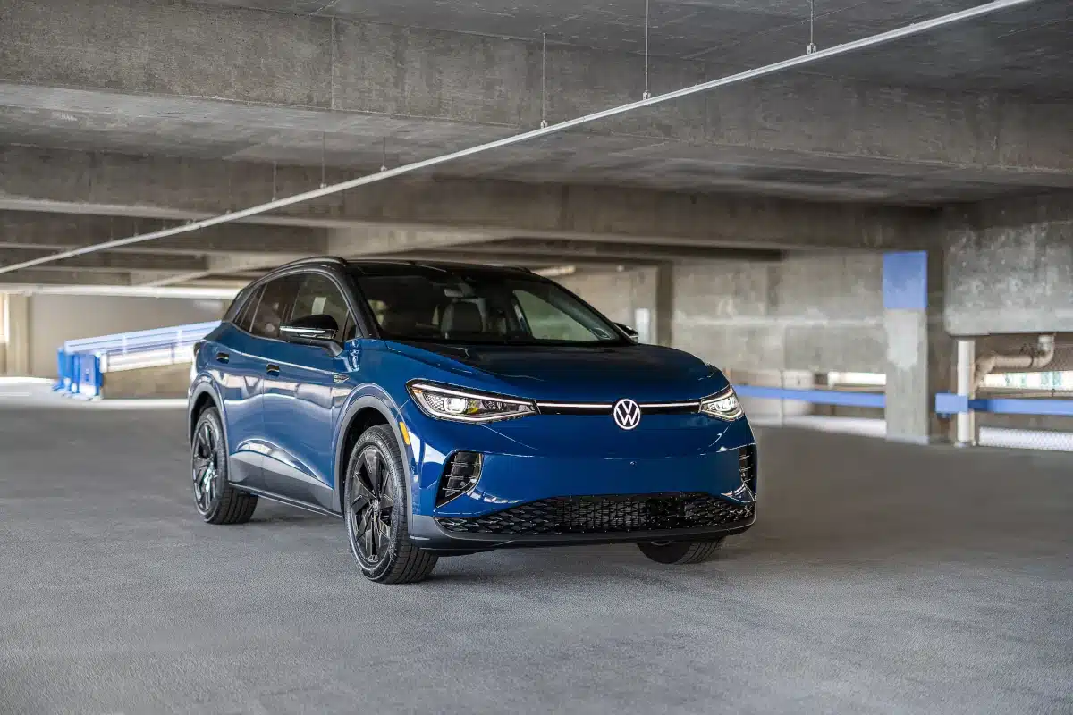 A blue Volkswagen ID.4 in a parking garage