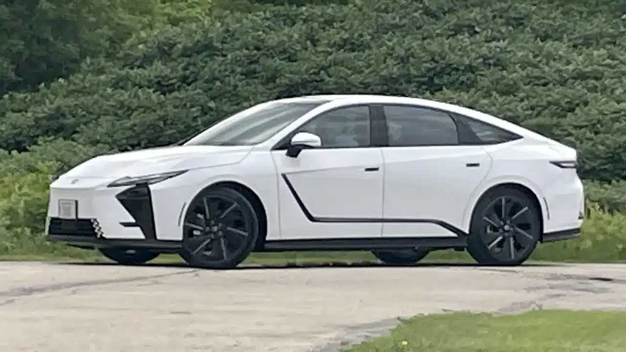 White 2026 Lexus ES parked beside trees